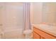 Bathroom featuring a toilet, sink with cabinet, and a shower-tub combo at 1040 Andalusia Loop, Davenport, FL 33837