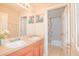 The bathroom features a double vanity and shower-tub combo at 1040 Andalusia Loop, Davenport, FL 33837