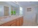 Bathroom with double sinks and soaking tub at 1040 Andalusia Loop, Davenport, FL 33837