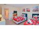 The bedroom features twin beds with themed bedding and decor at 1040 Andalusia Loop, Davenport, FL 33837
