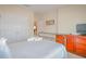 Bedroom featuring double closets and a doorway to another room at 1040 Andalusia Loop, Davenport, FL 33837