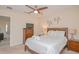 Cozy bedroom featuring a ceiling fan, soft lighting, and a comfortable bed at 1040 Andalusia Loop, Davenport, FL 33837