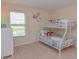 Bedroom with bunk bed, a dresser and view from a window at 1040 Andalusia Loop, Davenport, FL 33837