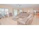 Bright living space featuring tile floors, neutral paint, and an open layout perfect for entertaining at 1040 Andalusia Loop, Davenport, FL 33837