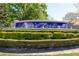 Decorative community sign for Susan's Landing, surrounded by lush green landscaping at 11139 Crooked River Ct, Clermont, FL 34711