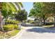 Gated community entrance with manicured landscaping and stately pillars for added security at 11139 Crooked River Ct, Clermont, FL 34711