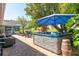 Backyard with a hot tub, patio, and outdoor seating for relaxing and entertaining at 11139 Crooked River Ct, Clermont, FL 34711