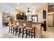 Well-appointed kitchen boasts a breakfast bar with seating, stainless steel appliances, and ample counter space at 11139 Crooked River Ct, Clermont, FL 34711