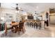 Spacious kitchen and breakfast bar area with bar stool seating and views to the rest of the house at 11139 Crooked River Ct, Clermont, FL 34711