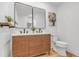 Modern bathroom with dual vanity, vessel sinks, and wooden cabinets at 116 E Cottesmore Cir, Longwood, FL 32779