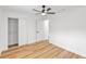 Bedroom featuring wood floors, a ceiling fan, and closet at 116 E Cottesmore Cir, Longwood, FL 32779