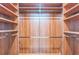 A spacious walk-in closet with custom shelving at 116 E Cottesmore Cir, Longwood, FL 32779