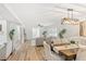 Open-concept living and dining space with hardwood floors and neutral decor at 116 E Cottesmore Cir, Longwood, FL 32779