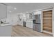 Open-concept kitchen boasts stainless steel appliances, ample cabinet space, and bright natural light at 116 E Cottesmore Cir, Longwood, FL 32779