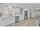 Modern kitchen showcasing stainless steel appliances, white countertops, updated fixtures and stylish design at 116 E Cottesmore Cir, Longwood, FL 32779