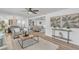 Bright and airy living room featuring hardwood floors, modern decor, and an open floorplan at 116 E Cottesmore Cir, Longwood, FL 32779