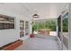 Enclosed patio with brick accents and view of the backyard at 116 E Cottesmore Cir, Longwood, FL 32779