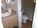Functional half-bath featuring a modern vanity, countertop, and tiled flooring at 1285 S South Beach Circle Cir, Kissimmee, FL 34746