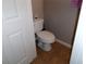 Clean half bathroom features a low-flow toilet and tiled floors for efficiency and comfort at 1285 S South Beach Circle Cir, Kissimmee, FL 34746