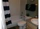 Comfortable full bath with a shower-tub combination, toilet, and simple vanity at 1285 S South Beach Circle Cir, Kissimmee, FL 34746