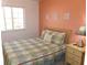 Comfortable bedroom features a bright window and a stylish lamp on nightstand at 1285 S South Beach Circle Cir, Kissimmee, FL 34746