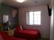 Cozy bedroom featuring two twin beds, neutral walls, and natural light from a window at 1285 S South Beach Circle Cir, Kissimmee, FL 34746