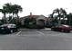 Clubhouse features tile roof, well maintained landscaping, and ample parking for residents and guests at 1285 S South Beach Circle Cir, Kissimmee, FL 34746