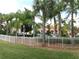 Community pool area with ample seating and lush landscaping providing a relaxing atmosphere at 1285 S South Beach Circle Cir, Kissimmee, FL 34746