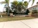 Attractive community sign set among palm trees and manicured landscaping for a welcoming entrance at 1285 S South Beach Circle Cir, Kissimmee, FL 34746