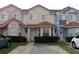 Charming multi-colored townhomes feature tile roofs and well-maintained landscaping, creating curb appeal at 1285 S South Beach Circle Cir, Kissimmee, FL 34746