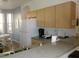 Functional kitchen area with wooden cabinets, granite countertops, and modern appliances overlooking breakfast nook at 1285 S South Beach Circle Cir, Kissimmee, FL 34746
