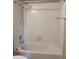 This bright, clean bathroom features a classic white tiled shower over tub at 13422 Exbury Ln, Windermere, FL 34786