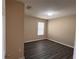 Bedroom features gray flooring, neutral paint, and a large window with blinds at 13422 Exbury Ln, Windermere, FL 34786