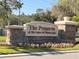 Stone entrance sign for The Preserve At The Lakes Of Windermere with colorful flowers at 13422 Exbury Ln, Windermere, FL 34786