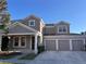 Charming home with a well-maintained lawn, three-car garage, and attractive curb appeal on a sunny day at 13422 Exbury Ln, Windermere, FL 34786