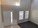 Foyer with front door, two windows and elegant wainscoting detail, and high ceilings at 13422 Exbury Ln, Windermere, FL 34786