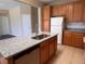 Bright kitchen boasts an island with granite countertops, a stainless steel sink, and ample cabinet space at 13422 Exbury Ln, Windermere, FL 34786