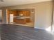 Open-concept living area blending seamlessly with the kitchen, showcasing modern flooring and natural light at 13422 Exbury Ln, Windermere, FL 34786