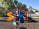 Community playground, with slides and climbing areas, providing fun activities for residents at 13422 Exbury Ln, Windermere, FL 34786