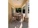 Pool clubhouse covered seating area with wooden patio furniture at 13422 Exbury Ln, Windermere, FL 34786