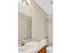 Neutral bathroom featuring a single sink vanity, toilet, and shower/tub combo with tiled walls at 14740 Hartford Run Dr, Orlando, FL 32828