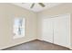 A bedroom featuring carpet, a window with blinds, and a closet with double doors at 14740 Hartford Run Dr, Orlando, FL 32828
