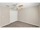 Bedroom with carpet, ceiling fan, and double door closet at 14740 Hartford Run Dr, Orlando, FL 32828