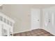 Bright entryway with tile flooring, white trim, and a staircase leading to the upper level at 14740 Hartford Run Dr, Orlando, FL 32828