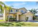 Beautiful two-story home with a well-kept lawn, professional landscaping, and a two-car garage at 14740 Hartford Run Dr, Orlando, FL 32828