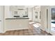 Bright open-concept kitchen with breakfast bar and tile floors with pool view at 14740 Hartford Run Dr, Orlando, FL 32828