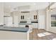 Well-lit kitchen with new white appliances, ample counter space, and plenty of storage at 14740 Hartford Run Dr, Orlando, FL 32828