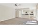 Spacious living room with stairs, tile floor, carpet, and access to kitchen at 14740 Hartford Run Dr, Orlando, FL 32828