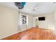 Bright bedroom with wood floors, ceiling fan, and a window providing plenty of natural light at 1475 Kettledrum Trl, Deltona, FL 32725