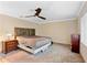 A bedroom featuring a ceiling fan, neutral walls, and carpet flooring at 1475 Kettledrum Trl, Deltona, FL 32725